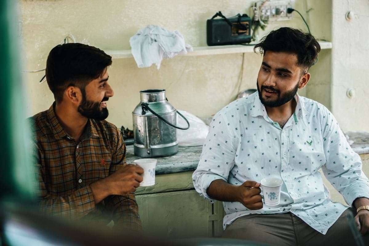 Two friends talking over tea