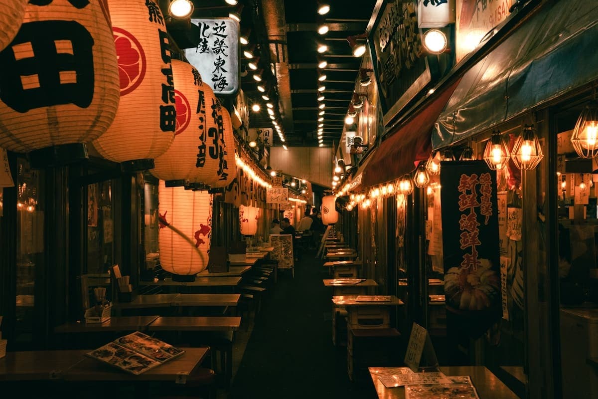Lantern-lit izakaya alley in Tokyo at night